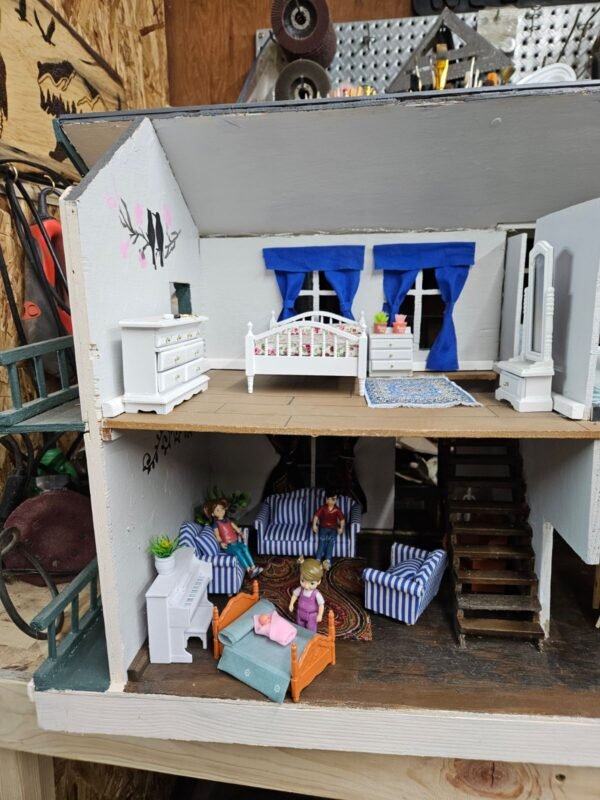 Restored handmade dollhouse- 2 bedrooms, bath, living room and kitchen. Includes all new furniture and accessories.