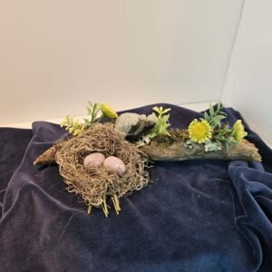 Tree branch with a nest containing two lithium amethyst eggs