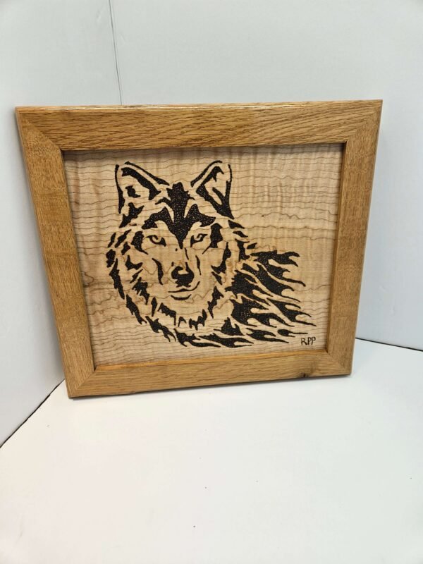 Black walnut-framed wolf on curly maple