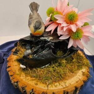 painted deer skull with antlers and bird with eggs in nest