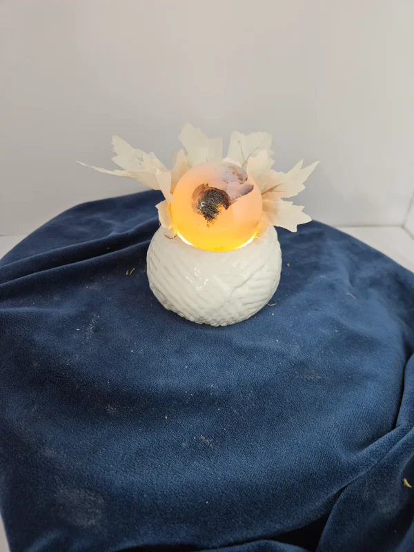 smal agate sphere on ceramic stand