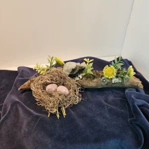 two amythest eggs in nest on branch with turtle and flowers