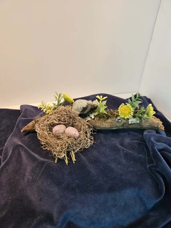 two amythest eggs in nest on branch with turtle and flowers