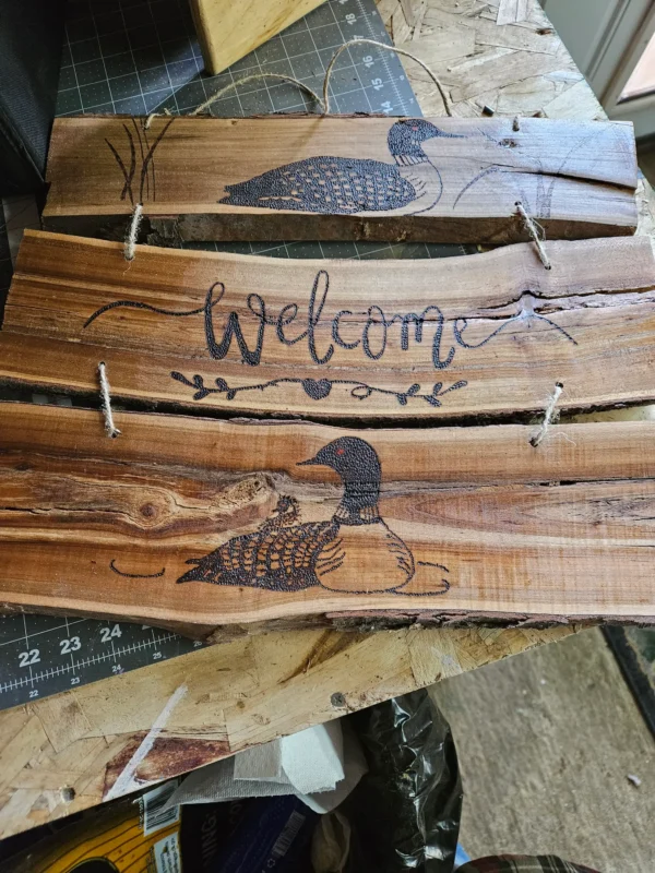 Woodburn Loon welcome sign on cherry