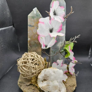 two agate towers and geode on river rock