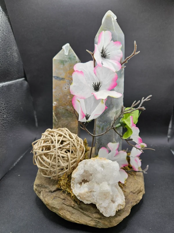 two agate towers and geode on river rock